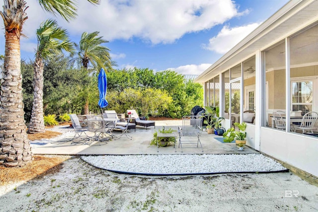 view of patio with a sunroom