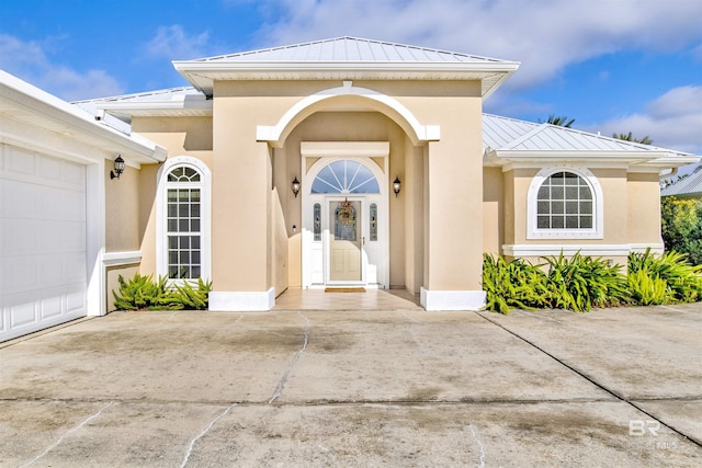 view of exterior entry featuring a garage