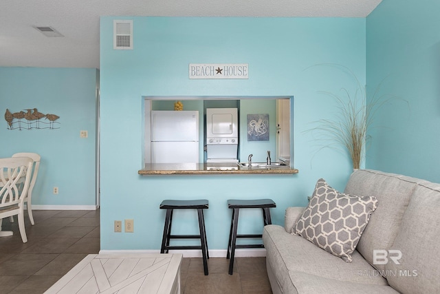 sitting room featuring tile patterned floors