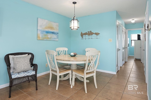 dining room with tile patterned floors