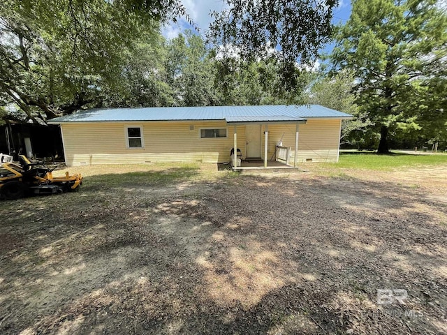 25850 Patterson Rd, Robertsdale, AL 36567 - rear view of house with metal roof and crawl space