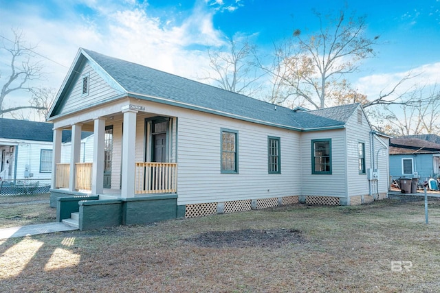 view of side of home featuring a porch