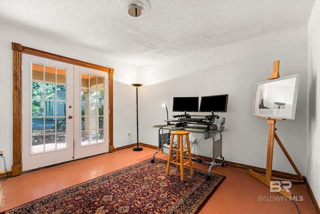 office area with a textured ceiling and french doors