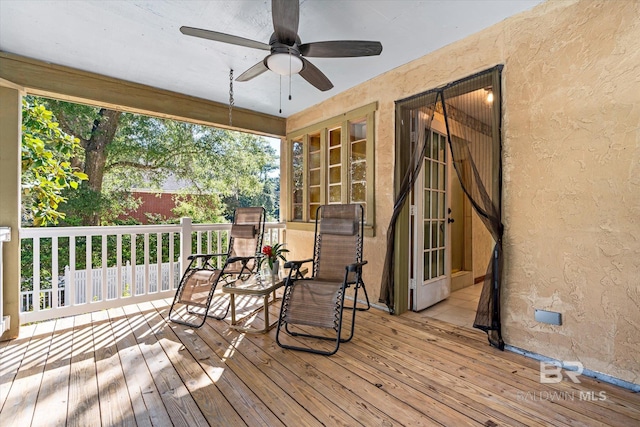 wooden terrace with ceiling fan