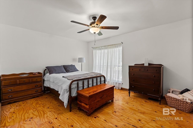 bedroom featuring light hardwood / wood-style flooring and ceiling fan