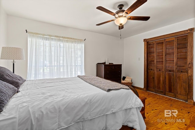 bedroom featuring ceiling fan and hardwood / wood-style flooring