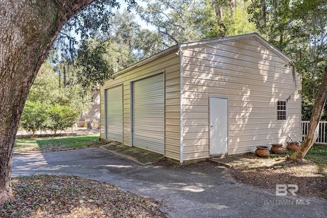 view of outbuilding with a garage