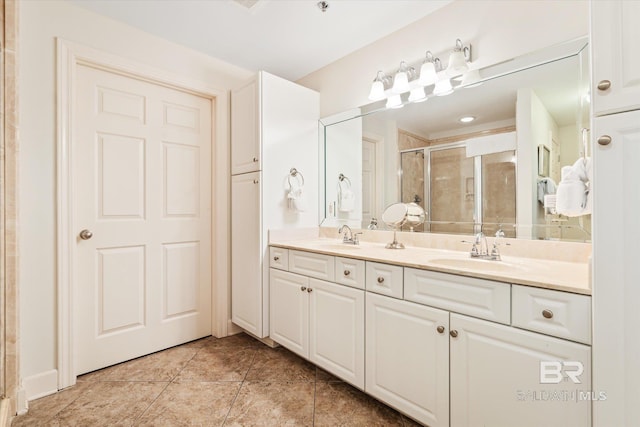 bathroom featuring vanity, tile patterned floors, and an enclosed shower