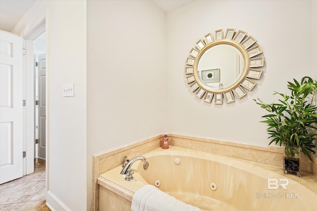 bathroom featuring tile patterned flooring and tiled tub