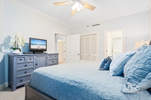 bedroom featuring ornamental molding, a closet, ceiling fan, and light colored carpet