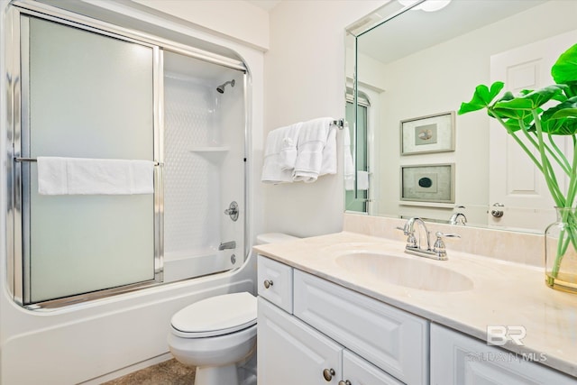 full bathroom with shower / bath combination with glass door, vanity, and toilet