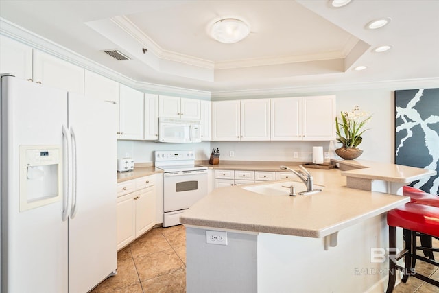 kitchen with a kitchen breakfast bar, white cabinets, white appliances, and sink