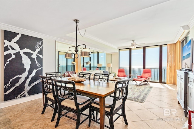 dining room featuring a wall of windows, crown molding, ceiling fan, and light tile patterned floors