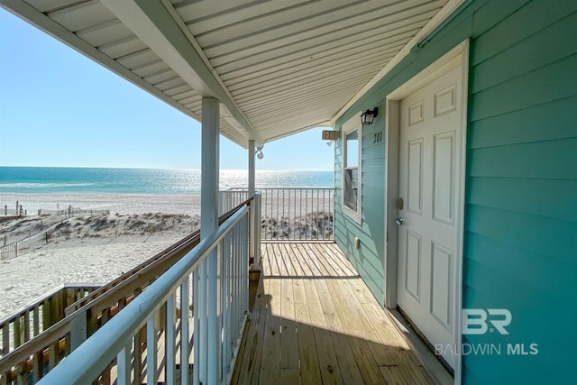 balcony with a view of the beach and a water view