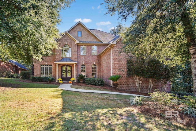 view of front of house featuring french doors and a front yard