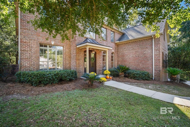 view of front of home with a front yard