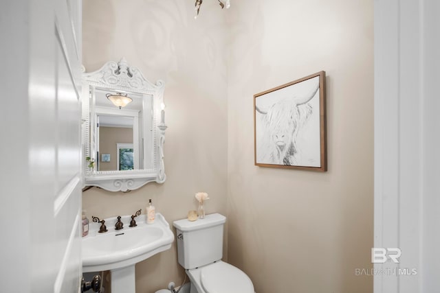 bathroom with sink and toilet