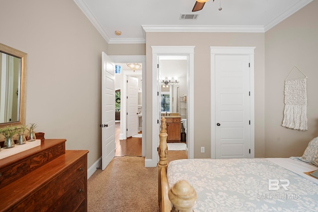 carpeted bedroom featuring crown molding, connected bathroom, and ceiling fan