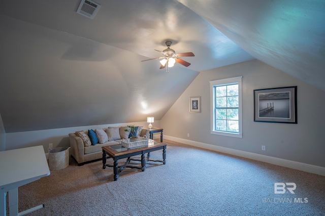 living room featuring ceiling fan, carpet, and vaulted ceiling