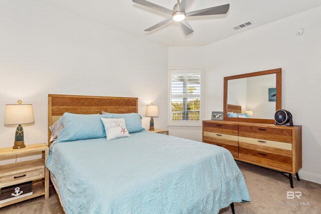 carpeted bedroom with ceiling fan