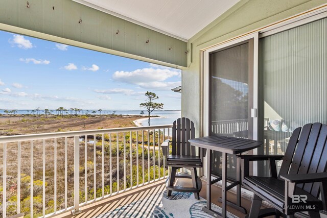 balcony featuring a water view