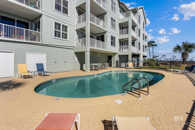 view of swimming pool with a patio area