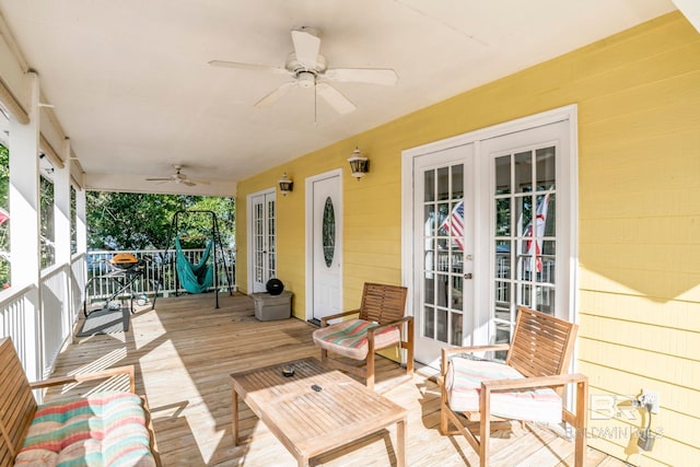 deck featuring ceiling fan and french doors