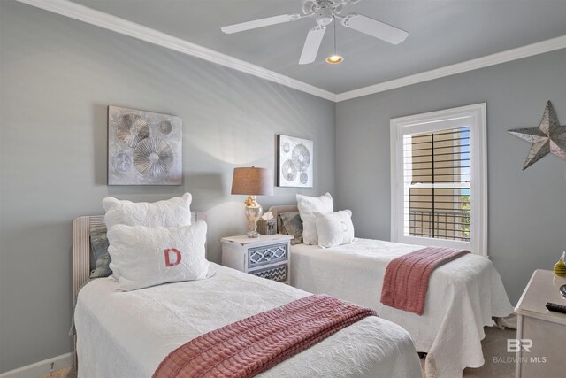 bedroom with ceiling fan and ornamental molding