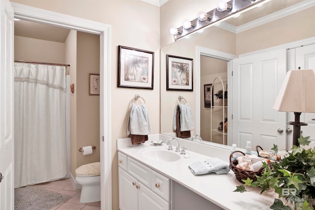 bathroom featuring tile patterned flooring, crown molding, toilet, and vanity