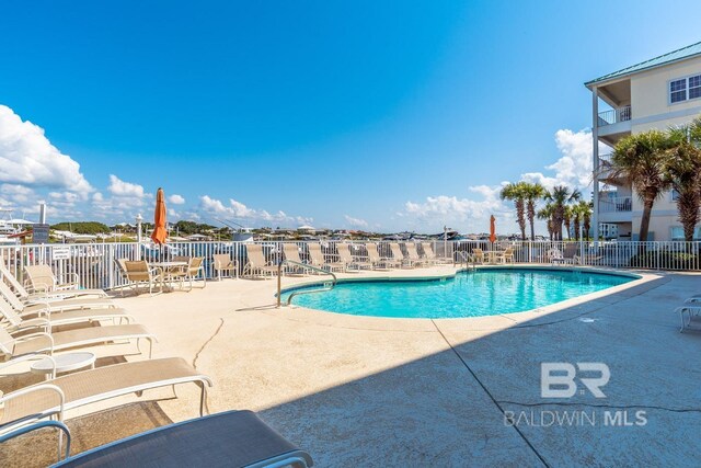 view of pool featuring a patio area