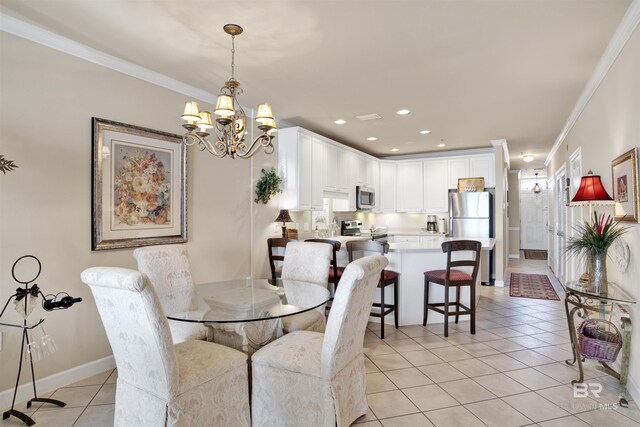 dining room with a notable chandelier, light tile patterned floors, and ornamental molding