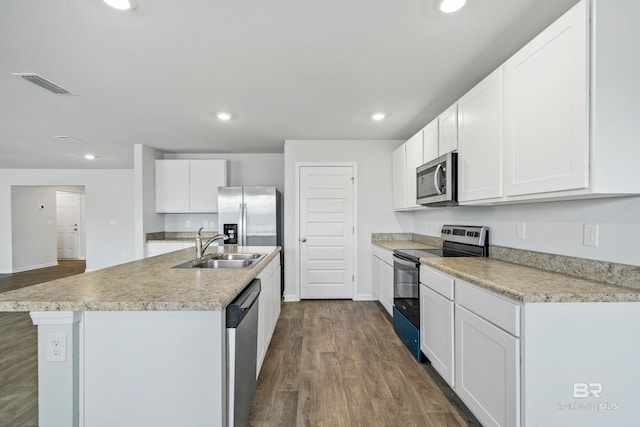 kitchen with white cabinetry, sink, a center island with sink, and appliances with stainless steel finishes