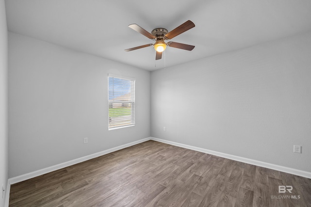 empty room featuring hardwood / wood-style floors and ceiling fan