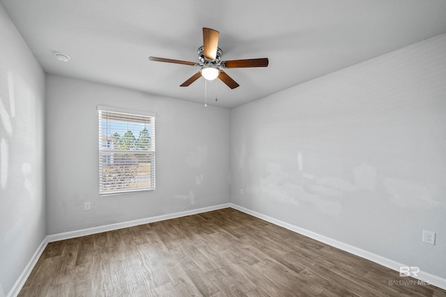 unfurnished room with wood-type flooring and ceiling fan