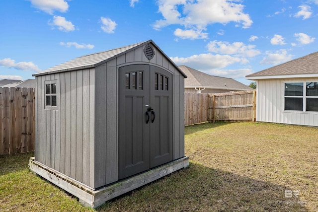 view of outbuilding featuring a lawn