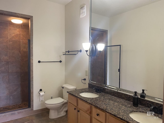 bathroom featuring toilet, walk in shower, and vanity