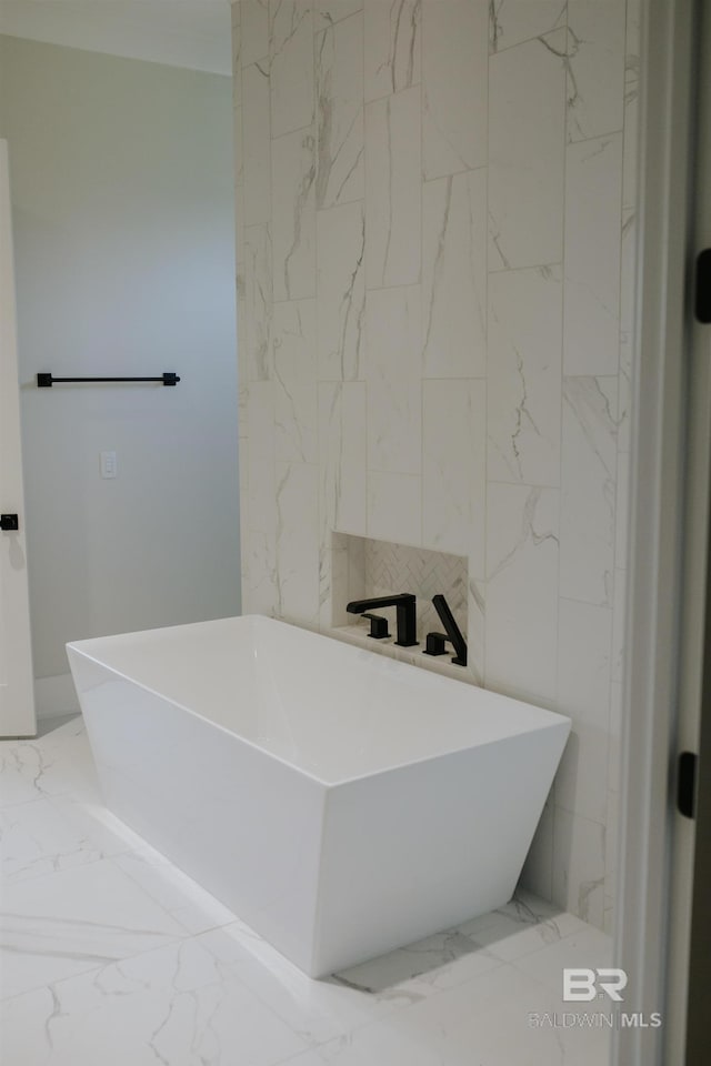21767 Gallery Blvd, Fairhope, AL 36532 - full bath featuring marble tiled flooring, a freestanding tub, and tile walls