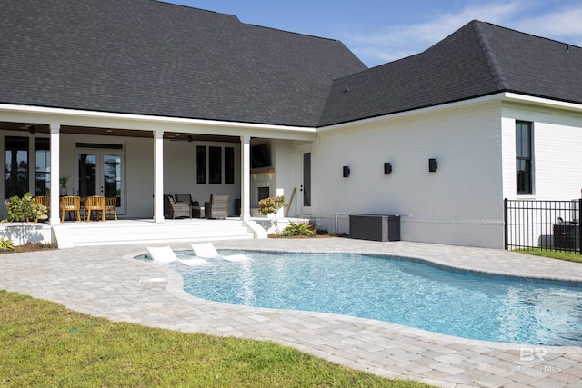 21767 Gallery Blvd, Fairhope, AL 36532 - view of swimming pool featuring french doors, a ceiling fan, a patio, and an outdoor living space
