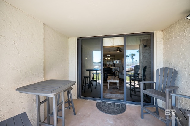 entrance to property featuring stucco siding