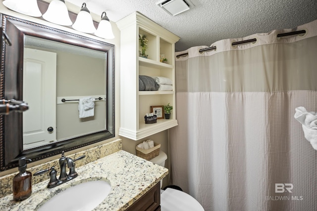 full bath featuring visible vents, a shower with curtain, toilet, a textured ceiling, and vanity