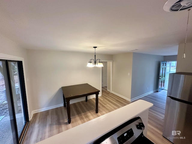 interior space featuring a notable chandelier and hardwood / wood-style flooring