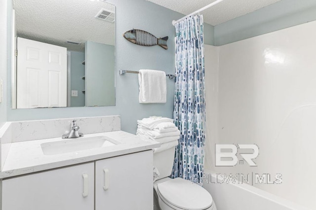 full bathroom with vanity, shower / tub combo, a textured ceiling, and toilet