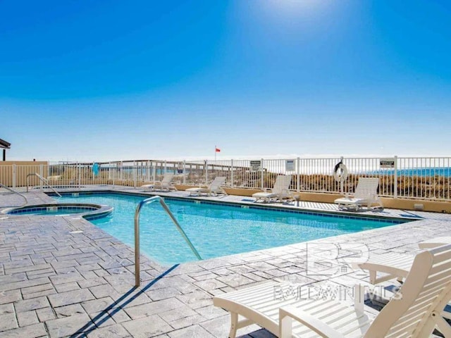 view of pool featuring a patio area and a community hot tub