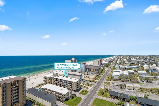 bird's eye view with a water view and a view of the beach