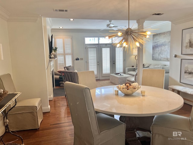 18175 Scenic Highway 98 Unit 12, Fairhope, AL 36532 - dining area with crown molding, wood finished floors, a fireplace, and recessed lighting