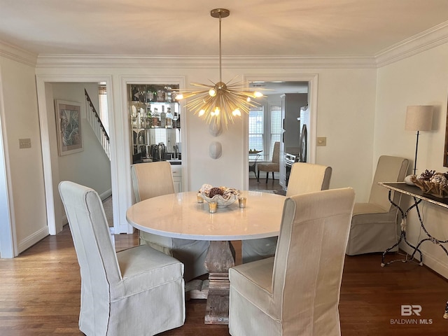 18175 Scenic Highway 98 Unit 12, Fairhope, AL 36532 - dining area with dark wood-type flooring, a chandelier, crown molding, and stairway