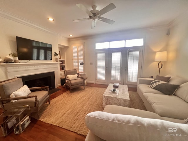 18175 Scenic Highway 98 Unit 12, Fairhope, AL 36532 - living area with ornamental molding, wood finished floors, a ceiling fan, a fireplace with flush hearth, and recessed lighting