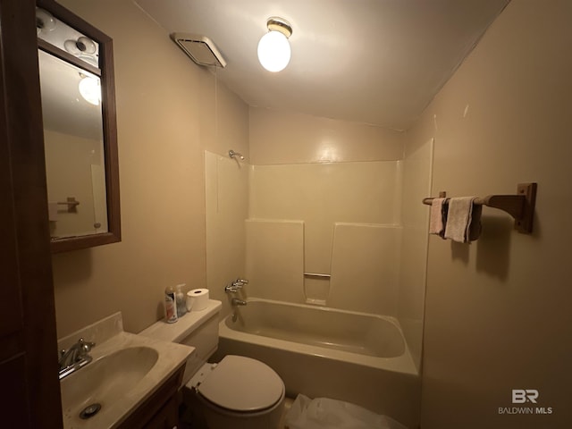 full bathroom featuring toilet, vanity, bathing tub / shower combination, and vaulted ceiling