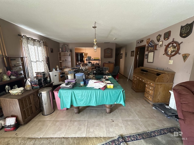 dining area featuring a textured ceiling