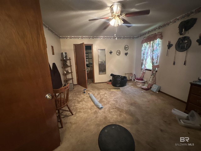 misc room featuring carpet flooring and ceiling fan